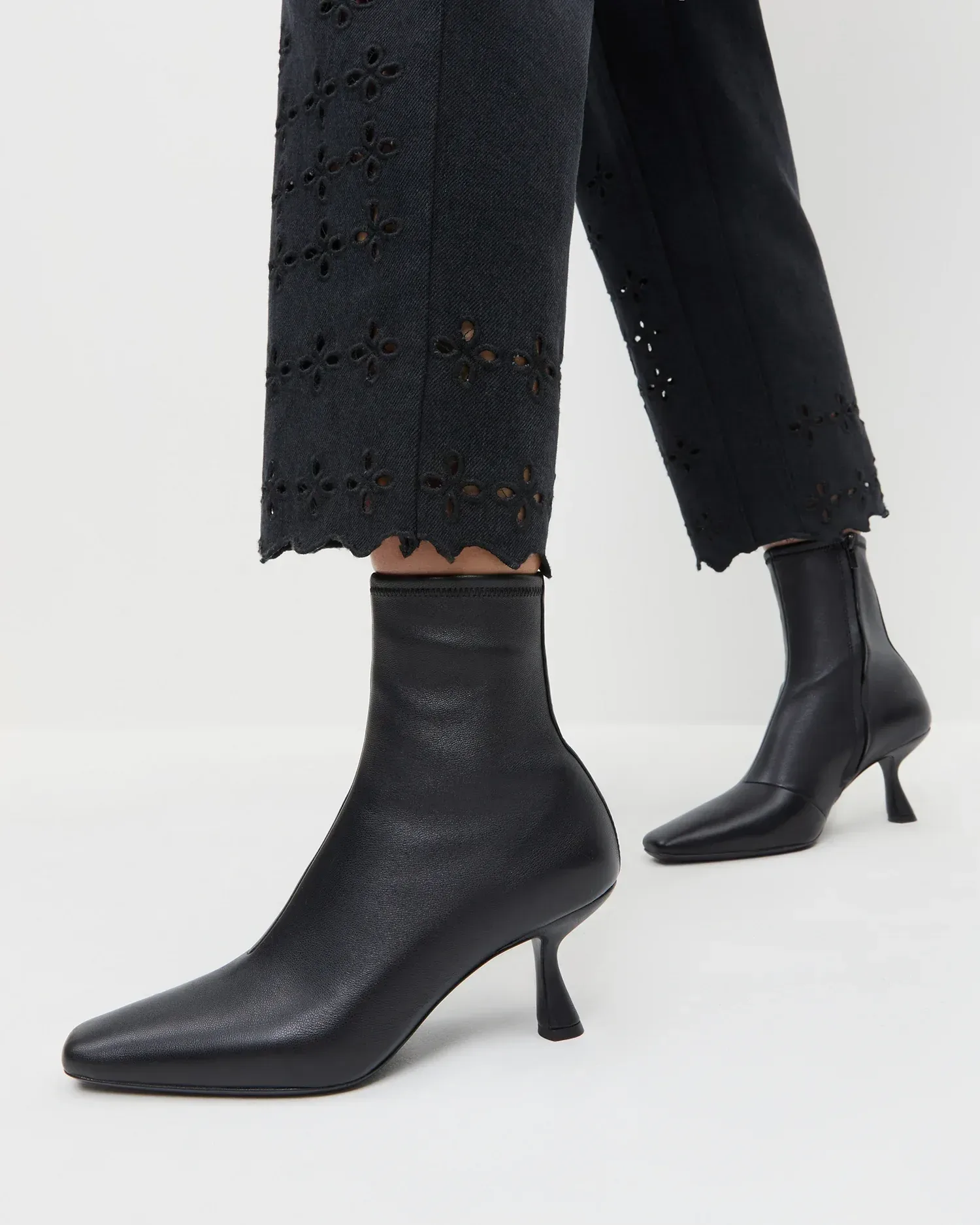 Thandy Black Leather Curved Heel Bootie